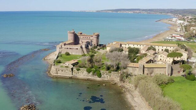 Aerial view of the Castle of Santa Severa, located in Santa Marinella in Lazio, in the Metropolitan City of Rome, Italy. It is a medieval castle built on the beach and overlooking the Tyrrhenian Sea.