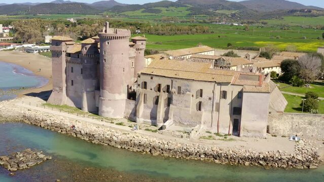 Aerial view of the Castle of Santa Severa, located in Santa Marinella in Lazio, in the Metropolitan City of Rome, Italy. It is a medieval castle built on the beach and overlooking the Tyrrhenian Sea.