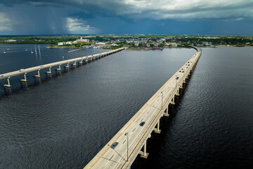 Barron Collier Bridge and Gilchrist Bridge in Florida with moving traffic. Transportation...