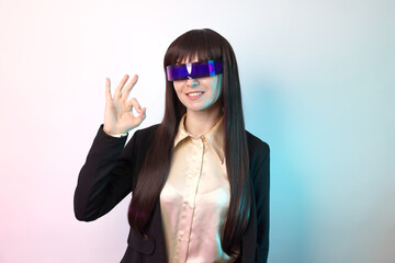 Beautiful female chatbot in business look with futuristic glasses, smiling and makes the OK hand gesture