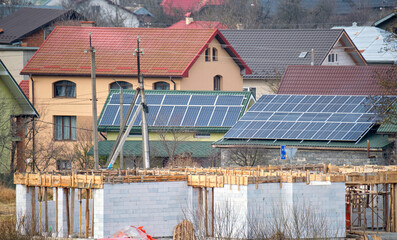 Unfinished frame of private house under construction in suburban area