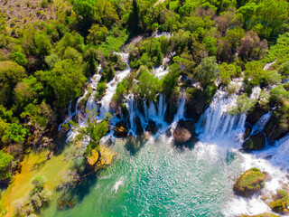 Drone aerial top down view of picturesque Kravice waterfalls in Bosnia Herzegovina. - obrazy, fototapety, plakaty