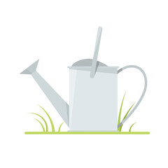 Metal big watering can on grass and white background