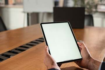 Close up of man using digital tablet.