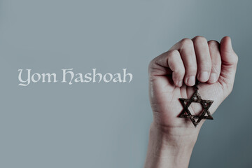 text Yom Hashoah and man with a star of David
