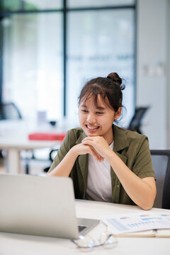 Young asian business woman or student working online on computer laptop.