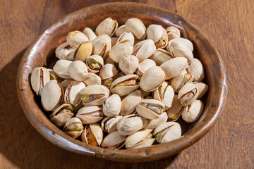 Roasted salty pistachio nuts, tasty healthy vegetarian food