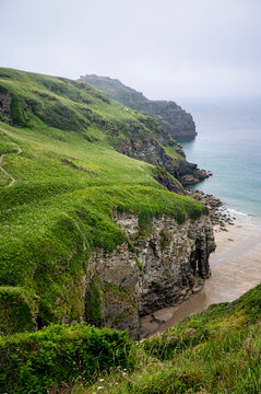 A view of lush cliffs along the coastline of Cornwall