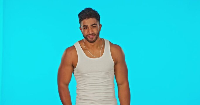 Muscle, confused and flexing man shrugging shoulder feeling unsure and isolated in a studio blue background. Strong, male and portrait of clueless bodybuilder asking a question with doubt