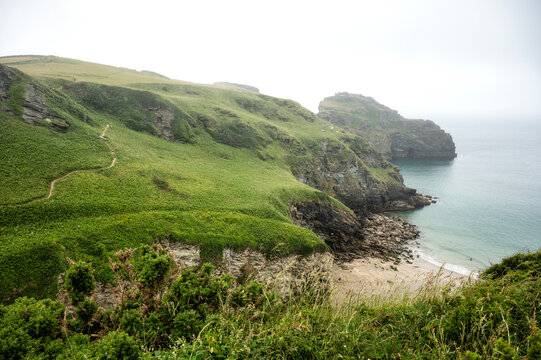 A view of lush cliffs along the coastline of Cornwall