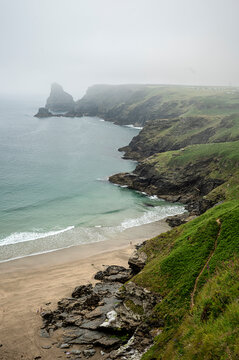 A view of lush cliffs along the coastline of Cornwall
