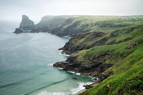 A view of lush cliffs along the coastline of Cornwall