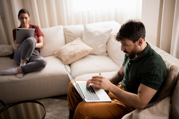 Couple of freelance colleagues working from home together.