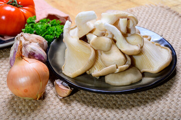 Tasty vegetarian food, fresh organic Pleurotus ostreatus, or oyster mushrooms, hiratake, or pearl oyster mushrooms