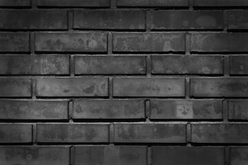 dark brick wall with illuminated center