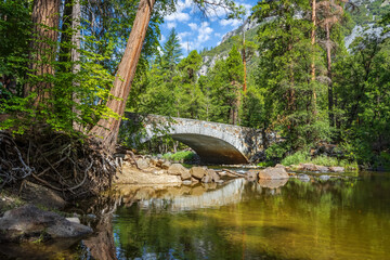 Fototapeta na wymiar Pohono bridge seen from the Merced river in Yosemite Valley, Yosemite National Park, USA