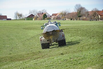 Agricultural machine in the farm watering and fertilizing the land with liquid animal manure.