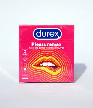 Ho Chi Minh City, Vietnam - March 28, 2023: Pink box of 3 latex condoms Pleasuremax of Durex brand isolated on white. Safety product for contraception and health protection during sex