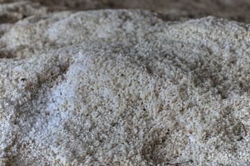 The uncrystallized salt is stored in the barn awaiting delivery to the salt mill. and other related industrial plants