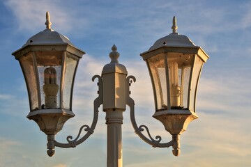 Fototapeta na wymiar Couple lanterns in a park with evening sunlight shining through