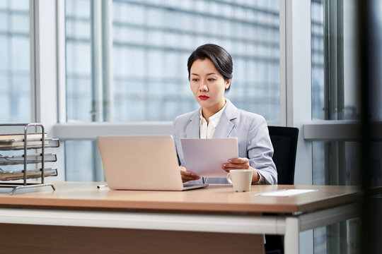 young asian businesswoman working in modern office