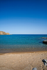 Fototapeta na wymiar Panoramic view of the wonderful turquoise sandy beach of Plakes in Ios Greece