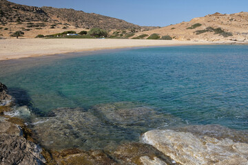 Fototapeta na wymiar Panoramic view of the wonderful turquoise sandy beach of Plakes in Ios Greece