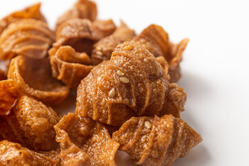 Conch shaped snacks on a white background