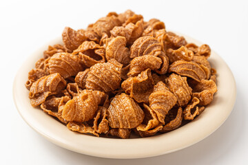 Conch shaped snacks on a white background