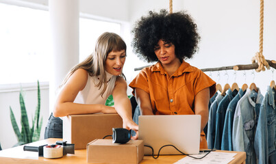 Thrift store owners preparing online orders in their shop
