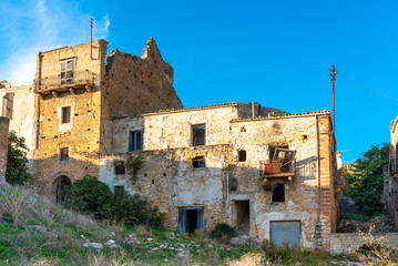 Poggioreale is a ghost town in the west of Sicily. The Belice Valley earthquake destroyed the entire town and killed 200 people in 1968. Today shrubbery overgrown the ruins 