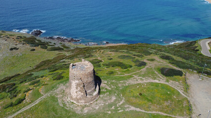 aerial view of the tower of flumentorgiu a few steps from the beach of torre dei corsari in southern sardinia

