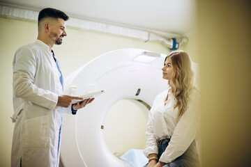 Man doctor with patient preparing before MRI scan