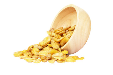 Nuts or Salted broad beans or vicia faba, on wooden cup. Crispy it's a snack. It is popular at...