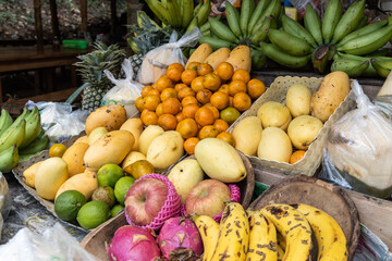 Group of locally grown nutritious tropical fruits display in stall for sale in Thailand