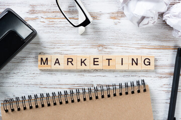Marketing strategy concept with letters on cubes