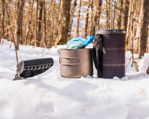 brerakfast ready winter camping close up coffee press, titanium pot, bag of oatmeal