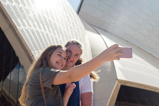 friends taking selfie at sydney opera house