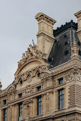 Fototapeta na wymiar Paris, France - 26.09.2021 : Detail of the facade of the Louvre museum in Paris..