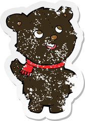 retro distressed sticker of a cartoon cute black bear cub