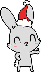 cute line drawing of a rabbit wearing santa hat
