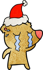 textured cartoon of a crying bear wearing santa hat