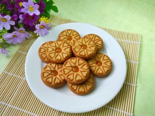 Biscuits with pineapple jam on a white plate