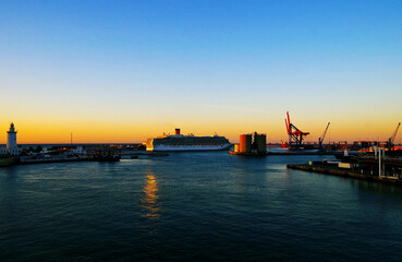 Fototapeta premium Modern white cruiseship or cruise ship liner Deliziosa in port of Malaga, Spain during Mediterranean cruising to Med islands for dream holiday vacation