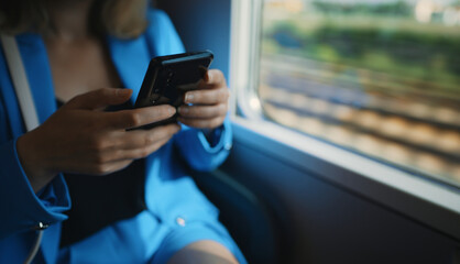 Woman in business suit travelling by the train.