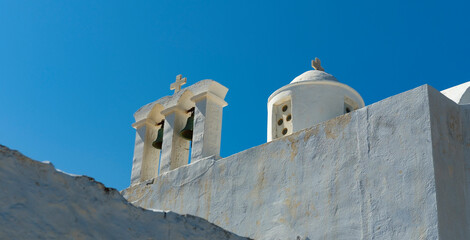 traditional greek orthodox church view whitewahed building in old venetian old town venetian castle at Milos Island, architechture in Greece