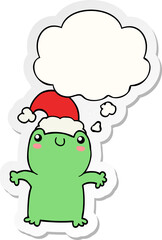 cute cartoon frog wearing christmas hat and thought bubble as a printed sticker