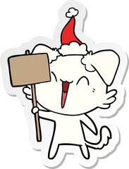 happy little sticker cartoon of a dog holding sign wearing santa hat