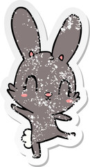 distressed sticker of a cute cartoon rabbit dancing