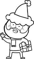 line drawing of a bearded man with present wearing santa hat